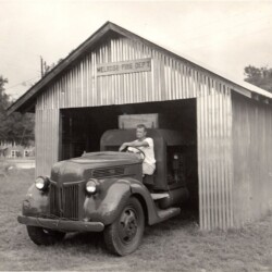 One of the first photographs of an organized fire system in Melrose, FL, circa 1950. Pictured is Julian V. Slade (1903-1981)