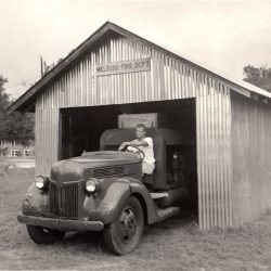 One of the first photographs of an organized fire system in Melrose, FL, circa 1950. Pictured is Julian V. Slade (1903-1981)